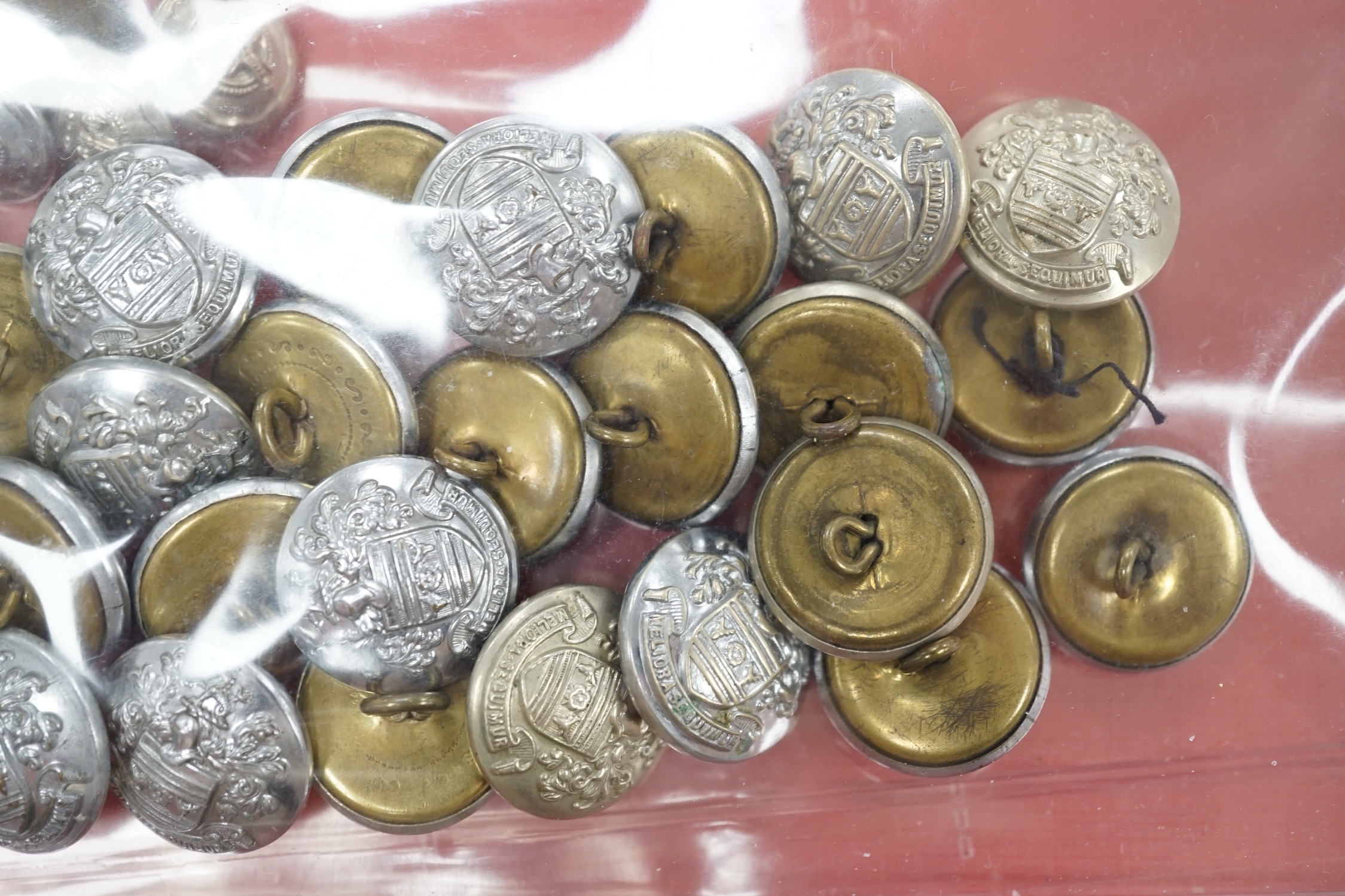 A collection of Police badges and buttons, including to Eastbourne Borough Police helmet plates, Eastbourne Fire Brigade uniform buttons, Royal Navy buttons, a whistle, etc. together with a batten decorated with beadwork
